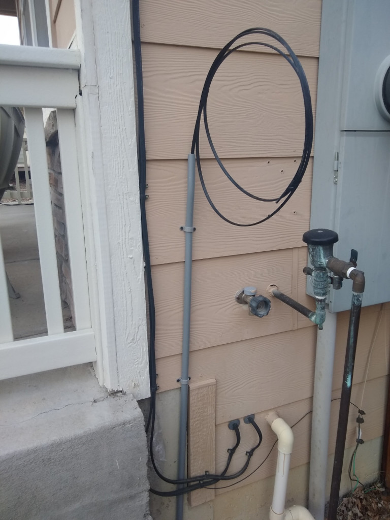 Newly run fiber from the street on the side of Coliln's house.